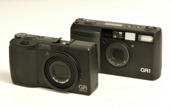 Picture of the GR1 and GR DIGITAL cameras. The GR DIGITAL is slightly smaller.
