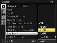 Press the [ADJ./OK] button down to select [Auto Bracket], and press the button to the right.