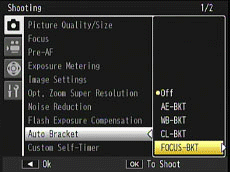 Press the [ADJ./OK] button up and down to select [FOCUS-BKT], and press the [ADJ./OK] button to the right.